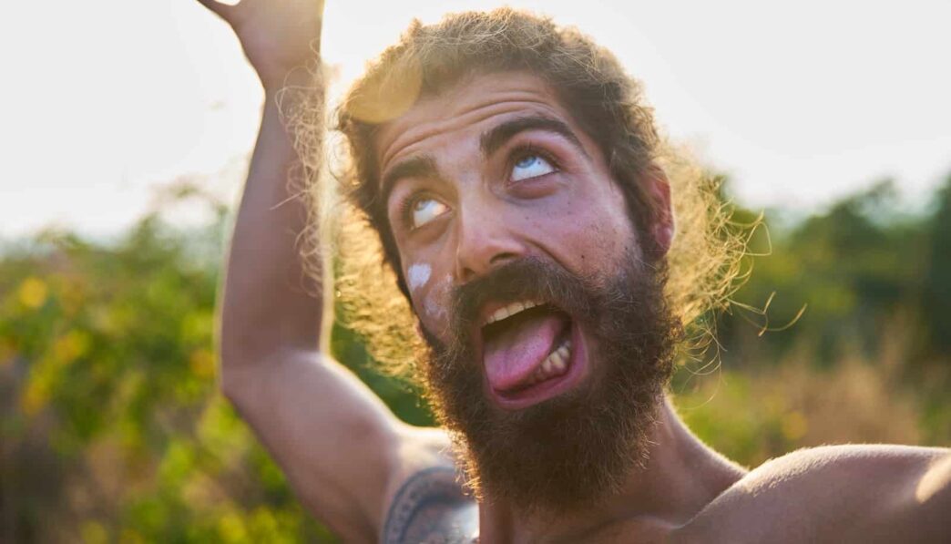 man sticking his tongue out