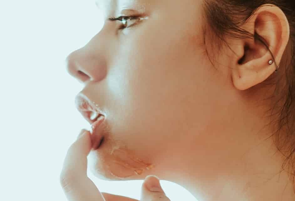 woman holding her lip