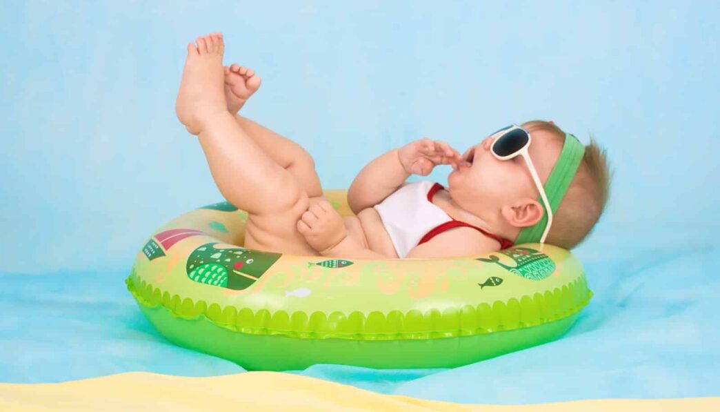 baby lying on inflatable ring