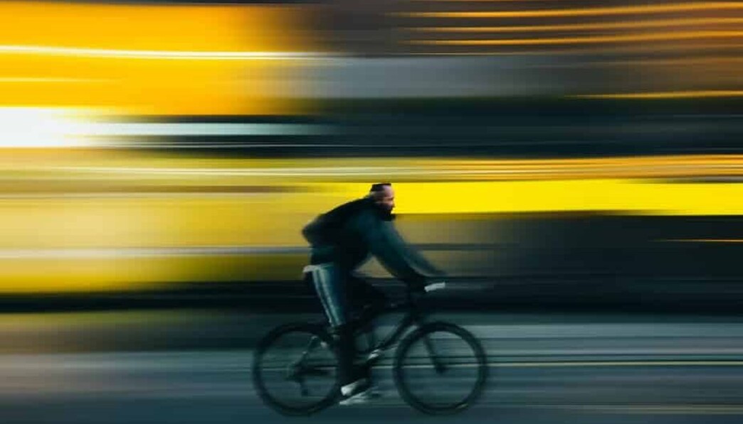 man riding bicycle on road during daytime
