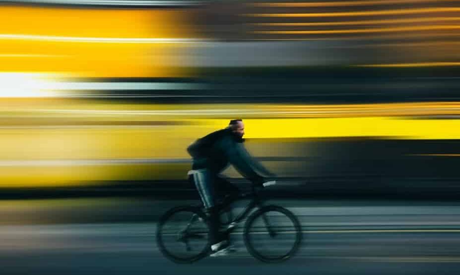 man riding bicycle on road during daytime