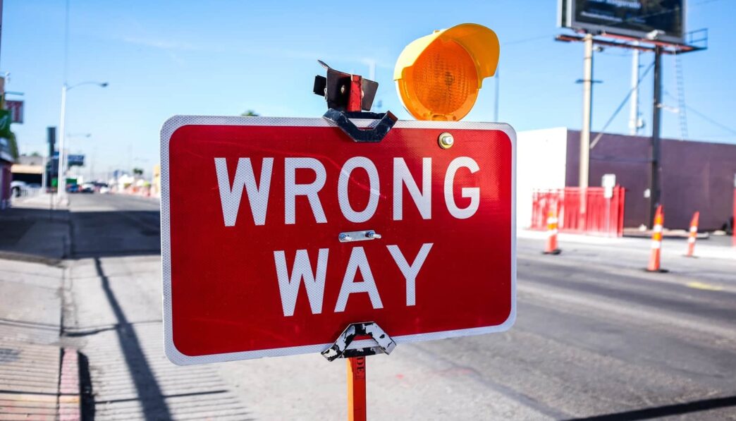 red Wrong Way signage on road