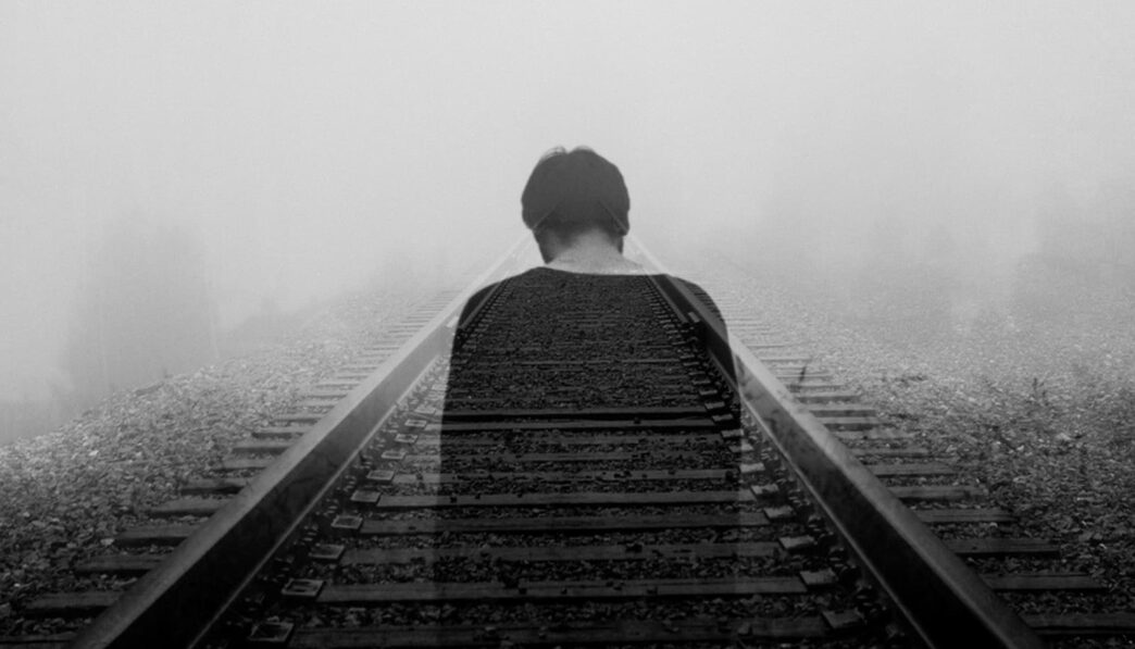 grayscale photo of man wearing black shirt