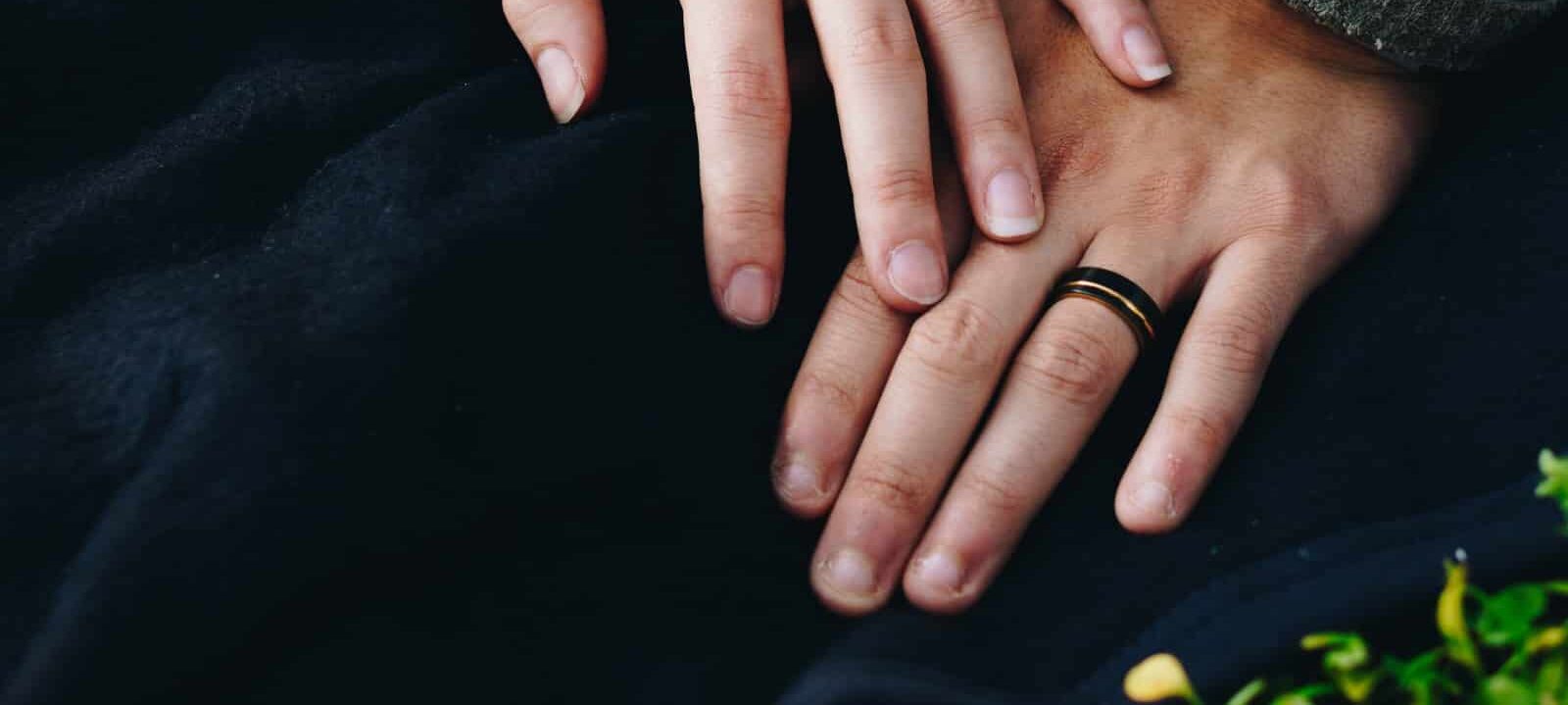 woman holding hand of man