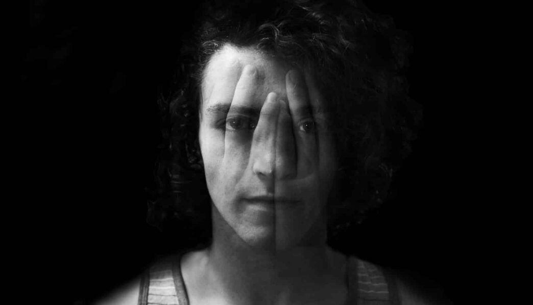 grayscale photo of man in tank top