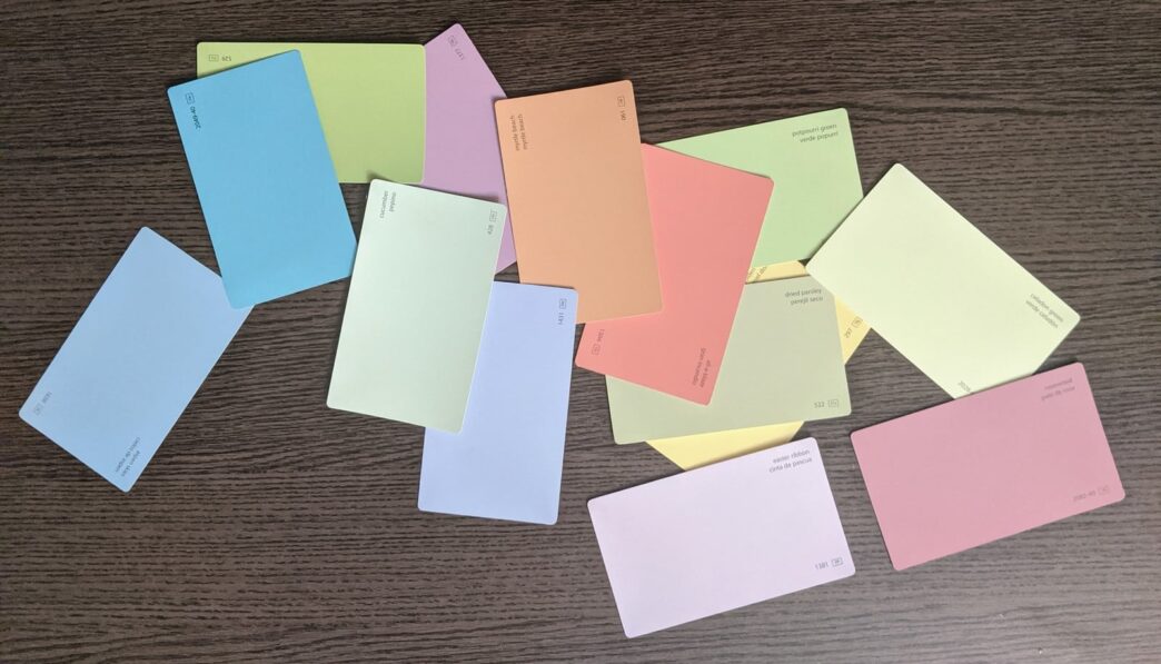 white green and yellow papers on brown wooden table