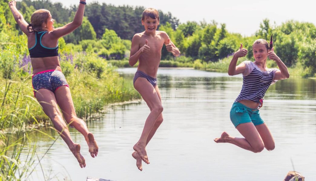 2 men running on water during daytime