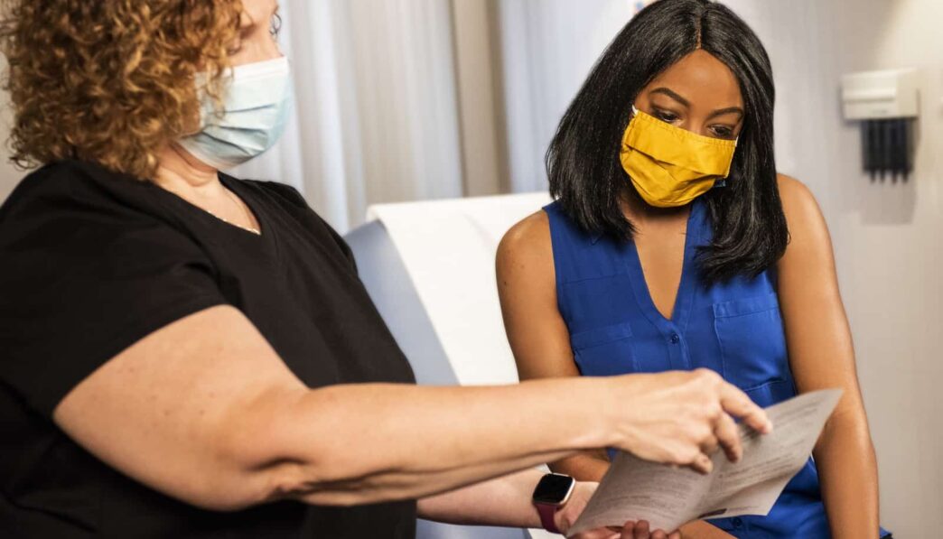 woman in black shirt wearing yellow mask
