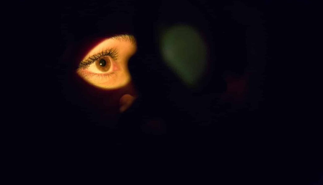 womans face with green eyes