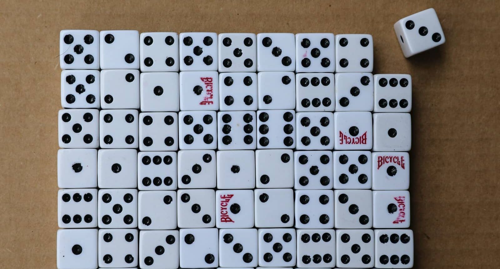 white and black calendar on brown wooden table