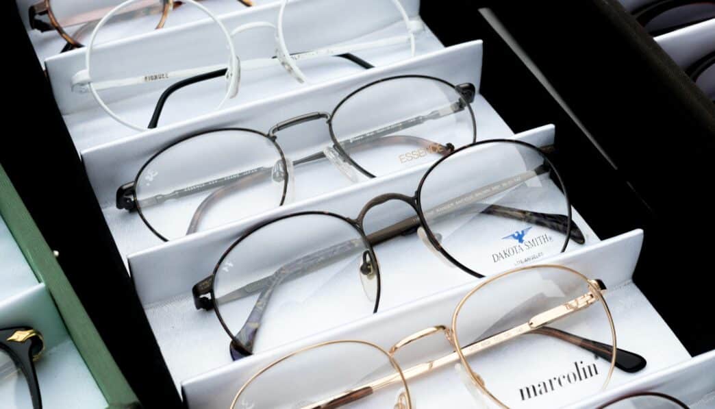 Close-up of assorted eyeglasses showcased in an orderly fashion for selection.