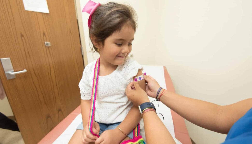 girl getting vaccine