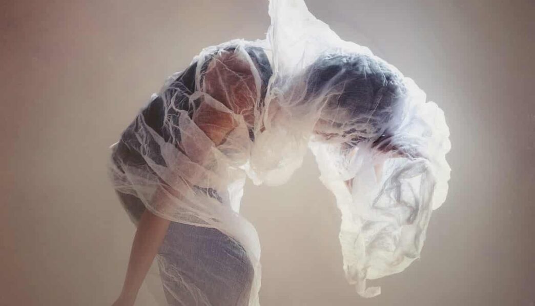woman wrapped on mesh fabric