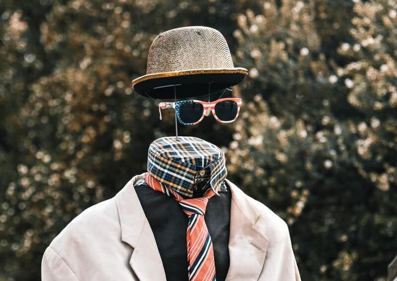necktie, hat, and sunglasses